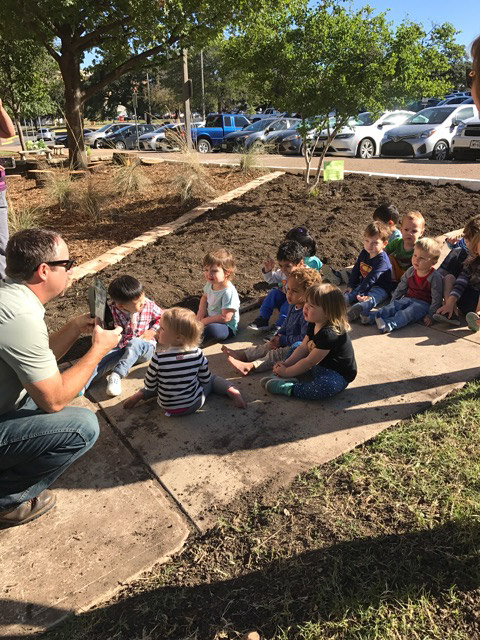 outdoor learning environment instructor talks to children